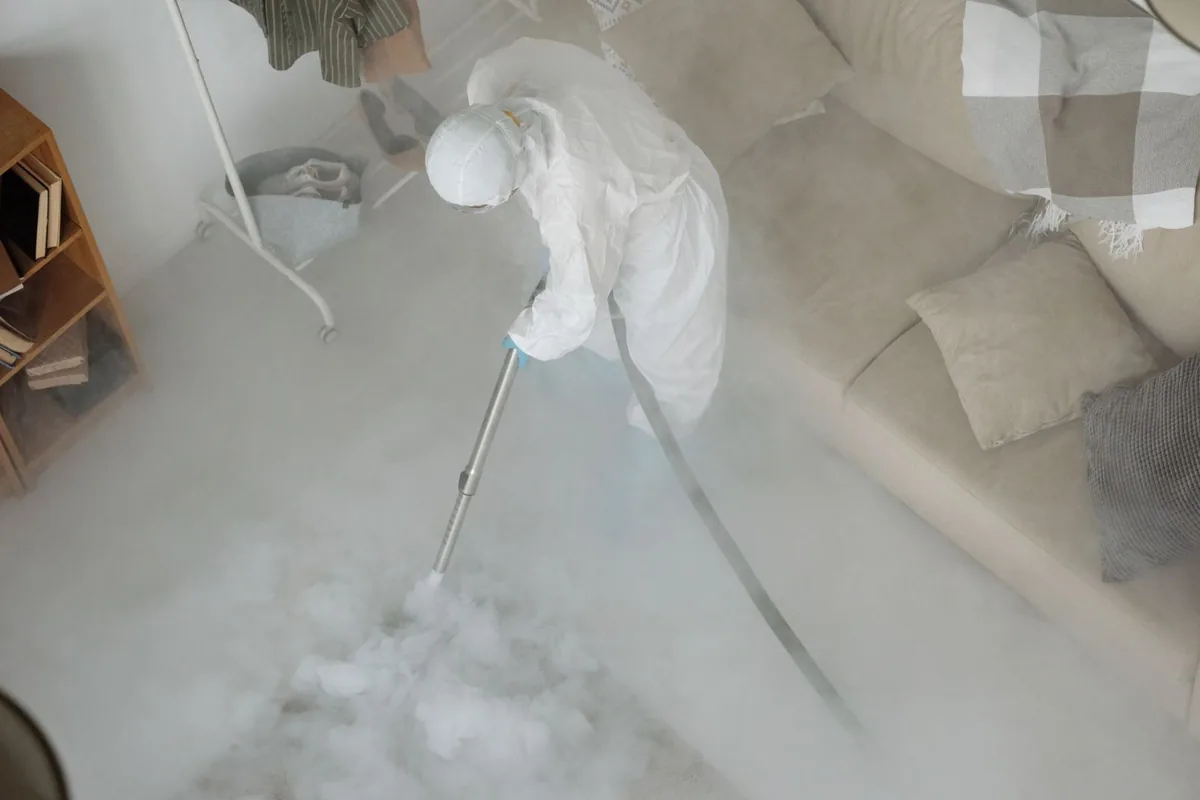Biohazard cleanup technician in protective equipment, Hicksville, OH